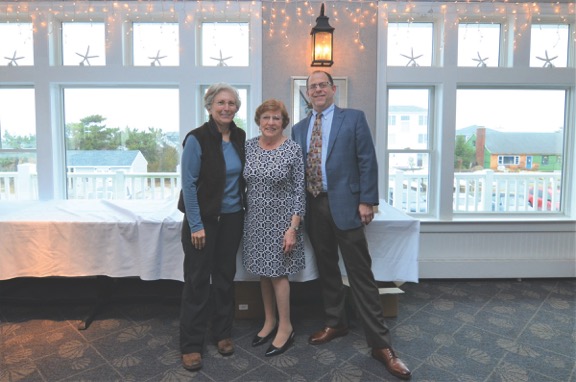 Chairman's Circle Gold Award winner Laurie Bronstein, left, poses with company owner Bette Gallo, and company broker and Vice President Andrew Ratner. Not shown is sales agent Terry Coleman.
